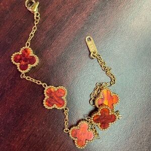 Elegant Gold and Red Clover Bracelet